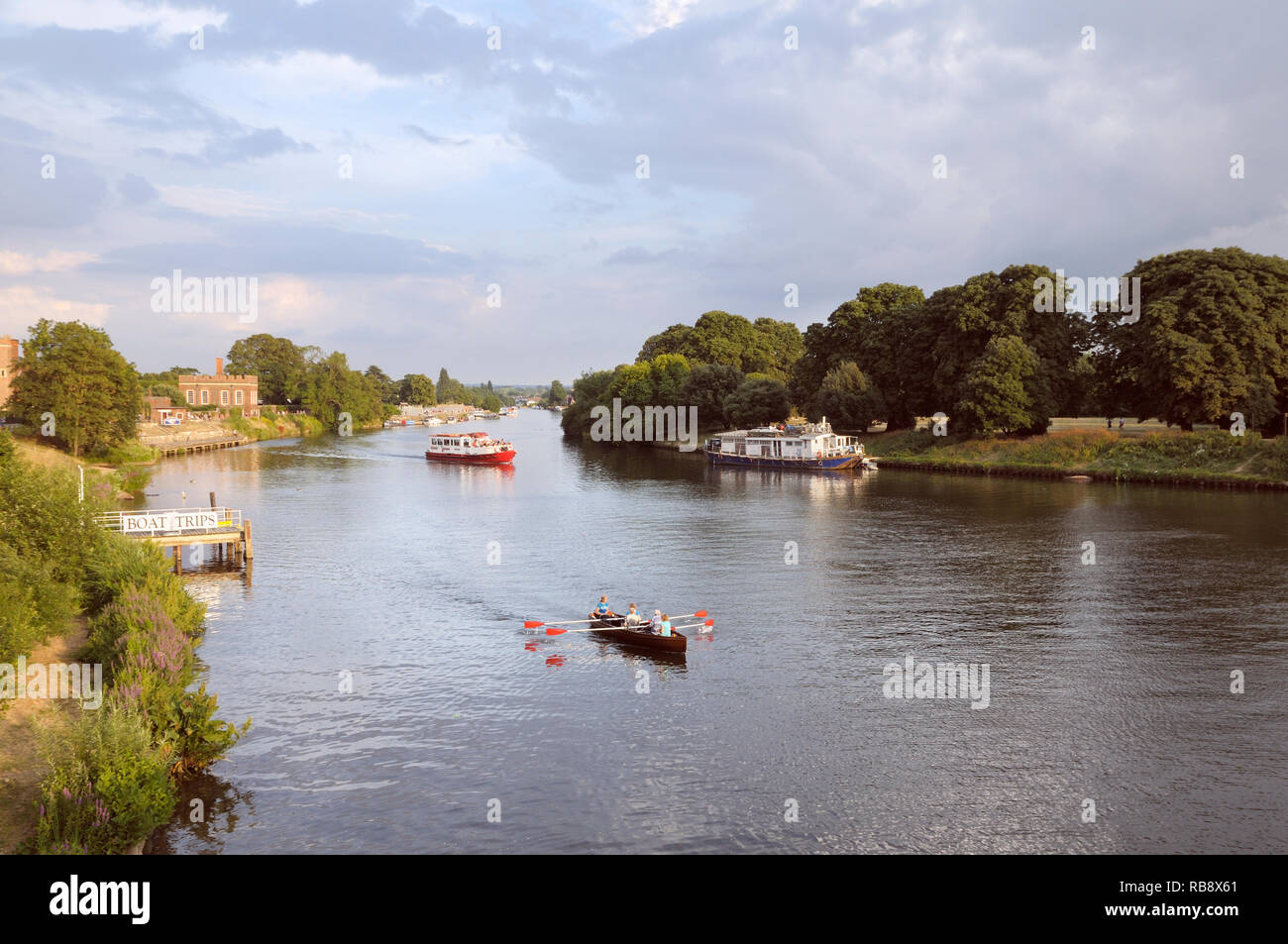Boats on the River Thames at Hampton Court on a lovely summer's evening, East Molesey, Surrey, Greater London, England, UK Stock Photo