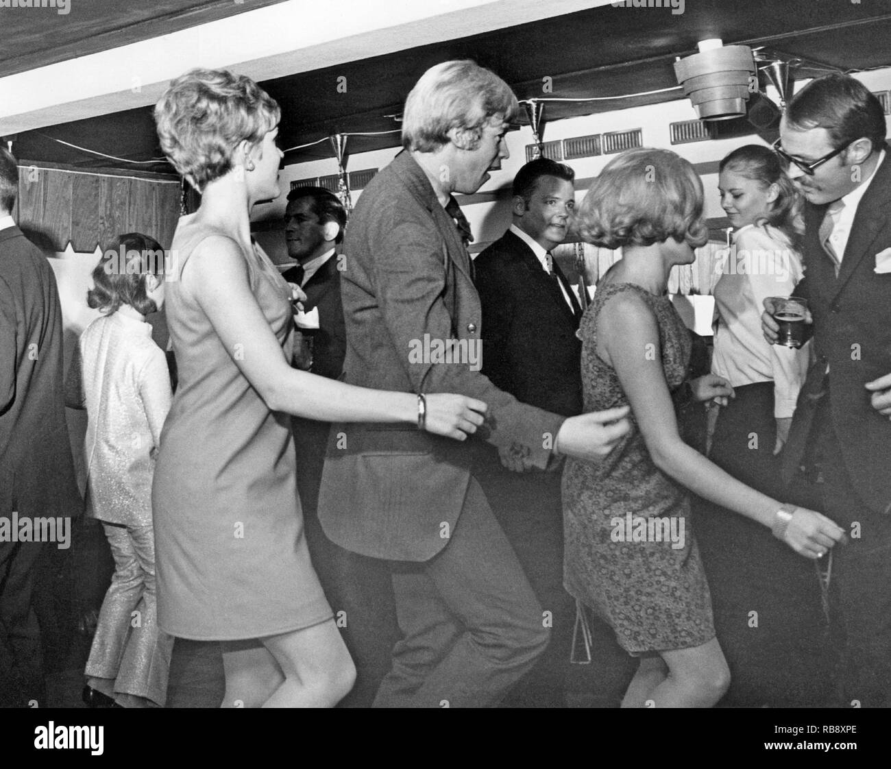 Dancing in the 1960s. The dance floor is filled with dancing couples moving to the music. Sweden 1967 Stock Photo