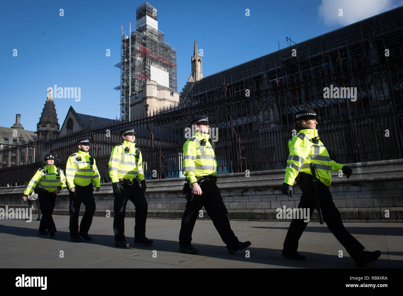 Metropolitan Police officers stand outside the Houses of Parliament in ...