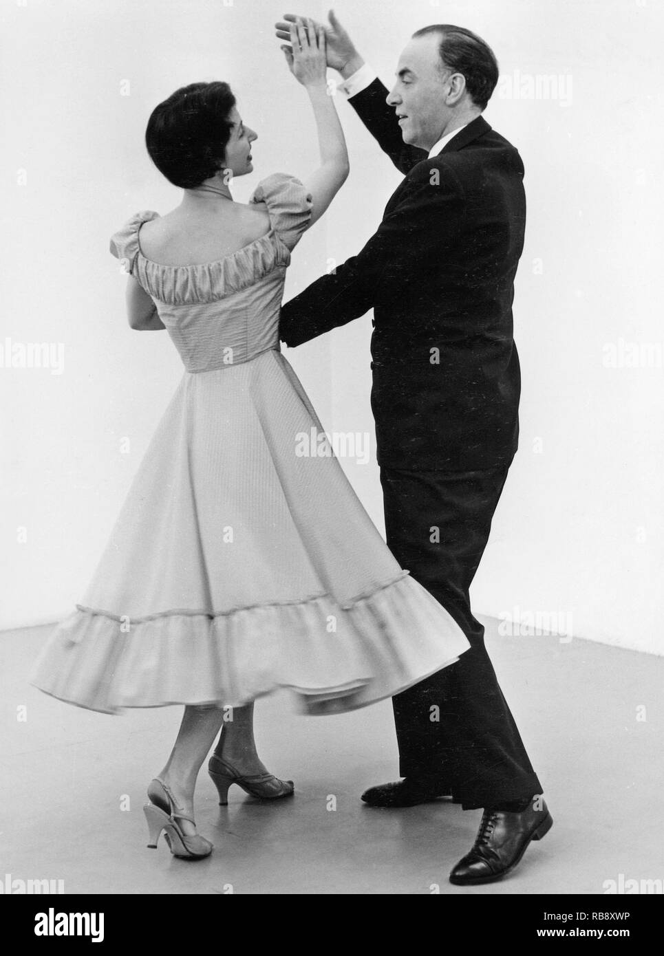 Learning to dance in the 1950s. A dancing teacher, Holger Rosenquist,  with his student, Gunnel Lindgren,  is learning how to dance the Mambo dance. Sweden 1955 Stock Photo