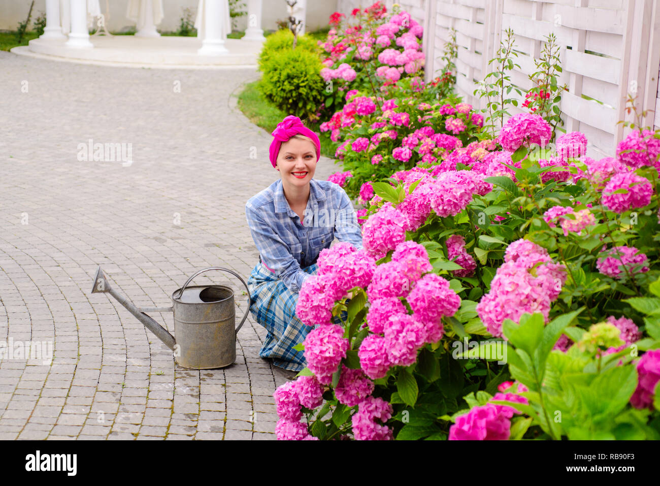 Happy Woman Gardener With Flowers Woman Care Of Flowers In Garden Or Greenhouse Gardener Is Happy For Results Gardening Is My Passion Everything For Your Gardening Needs Soils And Fertilizers Stock Photo