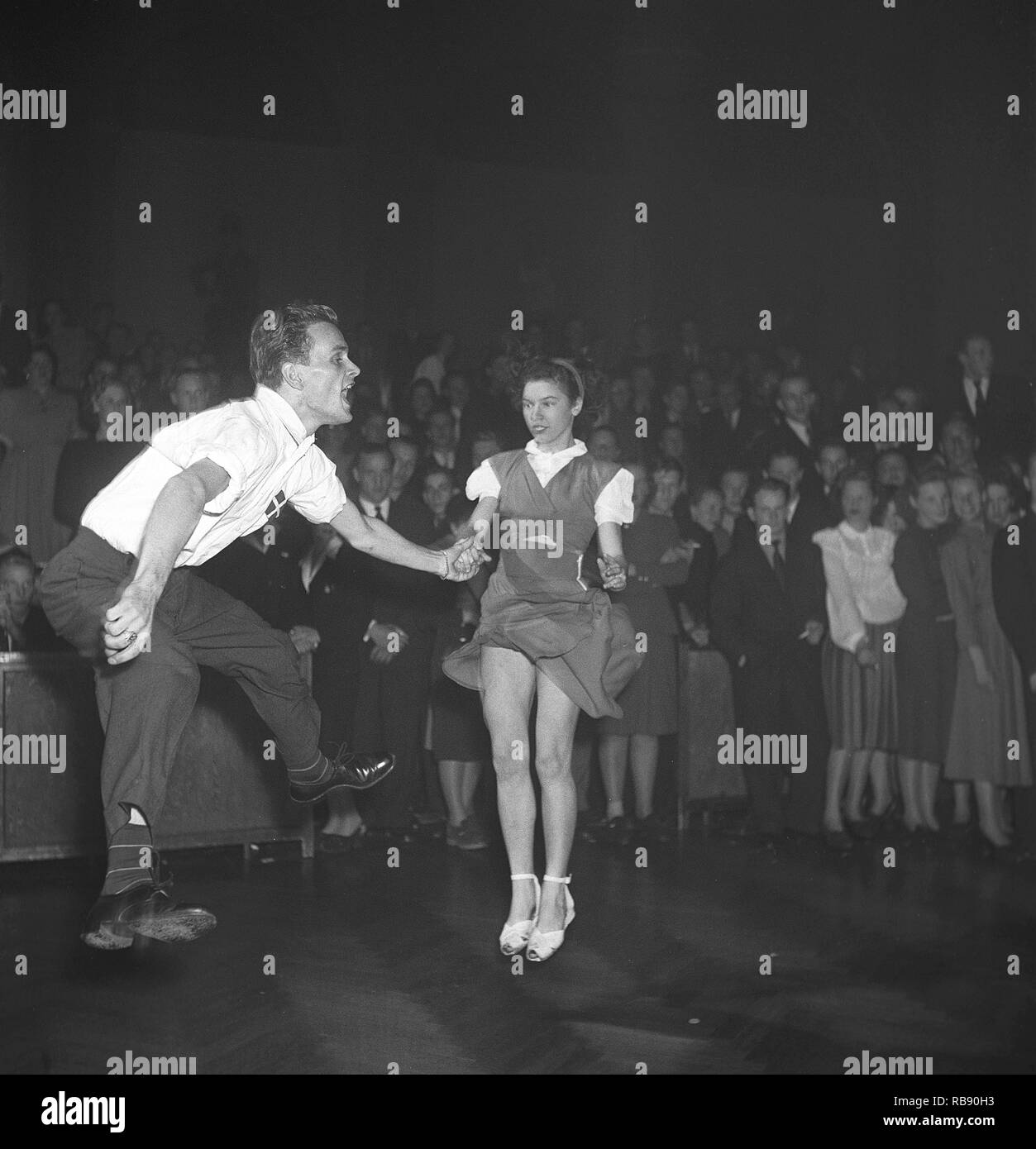 Jitterbug dance. A dance popularized in the United states and spread by American soldiers and sailors around the world during the Second world war. Pictured here the  young danish couple John Engklint and Margit Nielsen when dancing the Jitterbug dance 1948 during a competition dance event. Photo: Kristoffersson ref AM59-6 Stock Photo