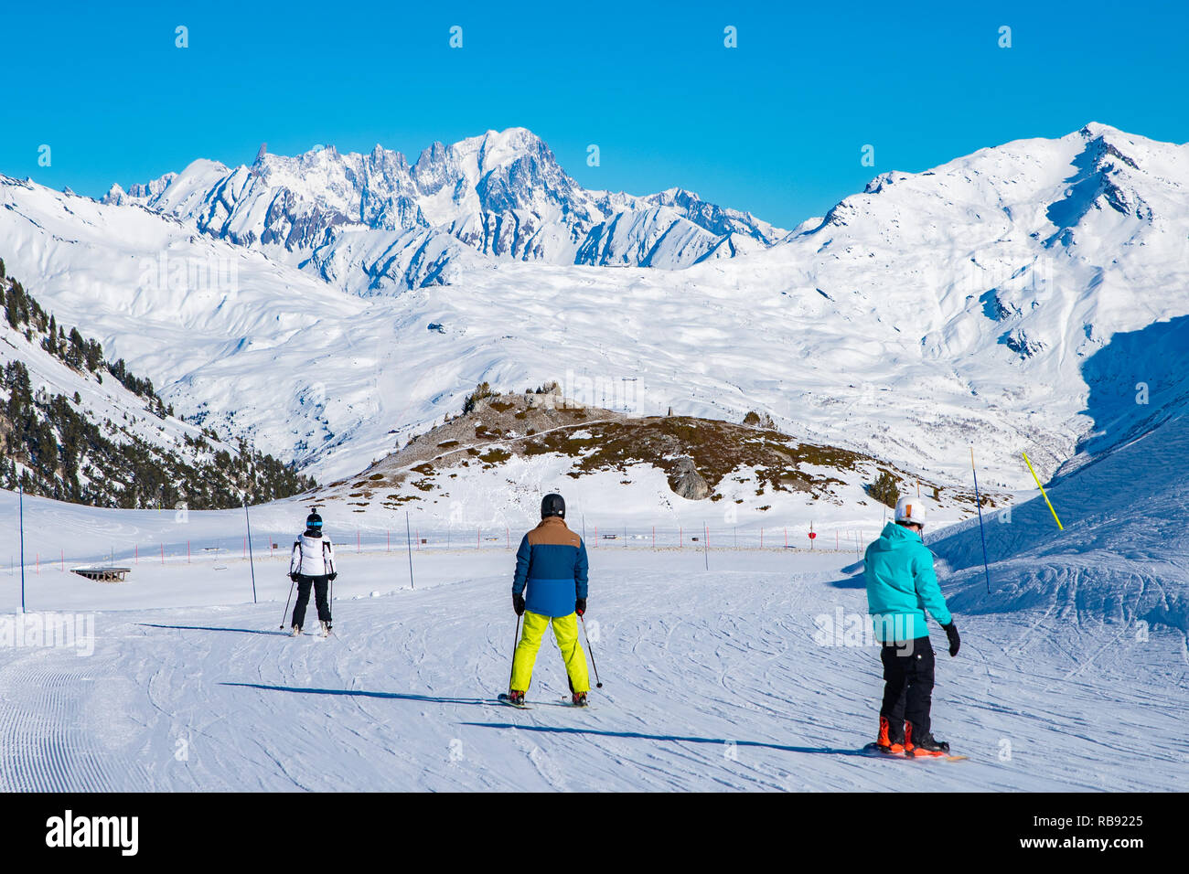 People enjoy ski and snowboard for winter holiday in Alps area with Mont Blanc as background, Les Arcs 2000, Savoie, France, Europe Stock Photo