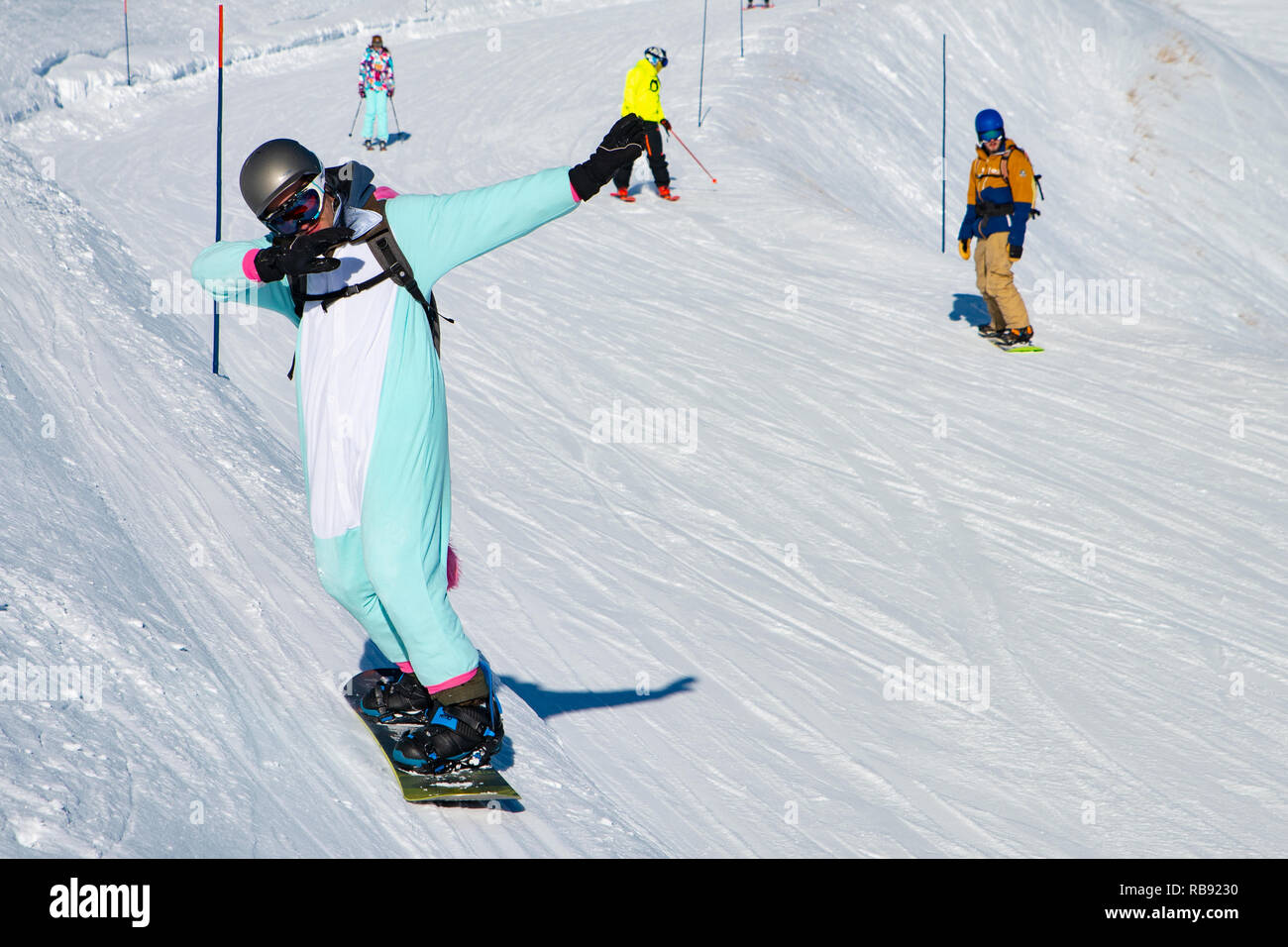 People enjoy snowboard for winter holiday in Alps area, Les Arcs 2000