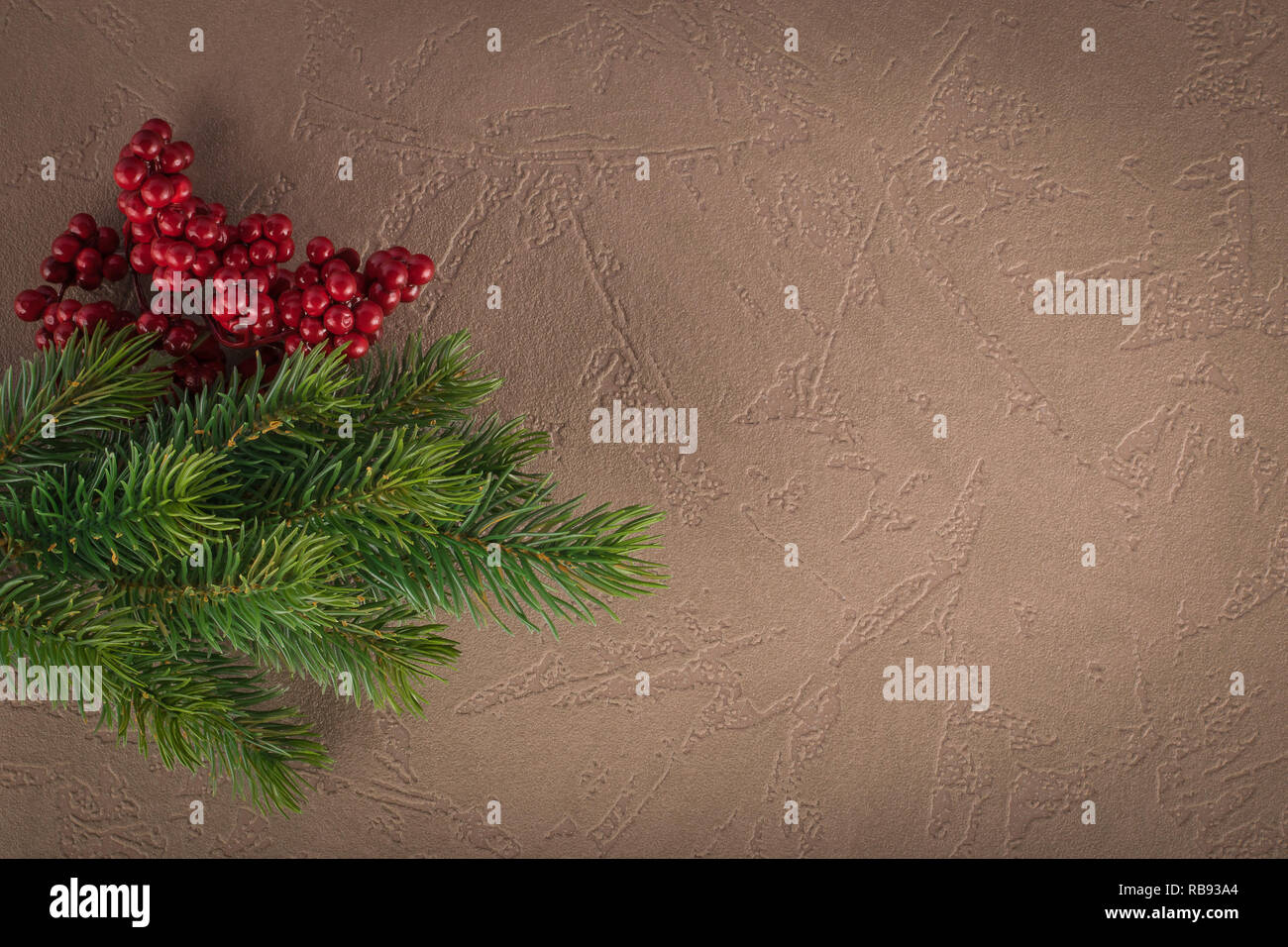 Composition of Christmas tree branch and red berries Stock Photo