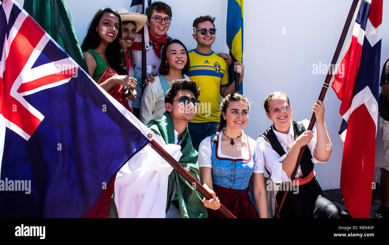 A group of young people from different countries are posing for a beautiful group photo Stock Photo