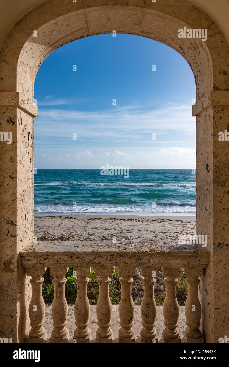 Archway view of the Atlantic Ocean from the Worth Avenue Clock Tower on the beach in Palm Beach