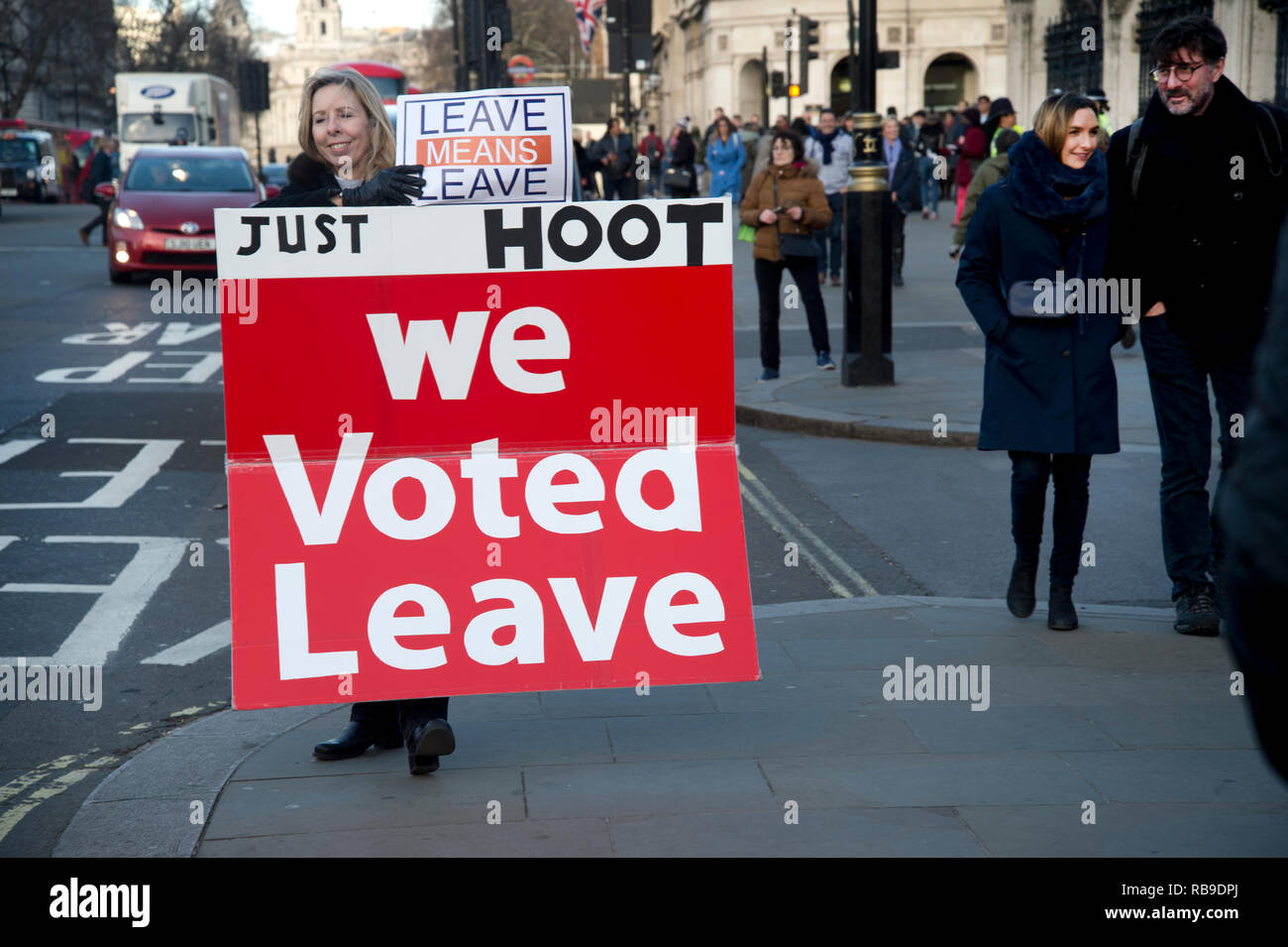 London, UK. 08th Jan, 2019. Westminster, London, England, UK. Lunchtime protest against Brexit. A woman holds a sign saying 'We voted Leave'. Credit: Jenny Matthews/Alamy Live News Stock Photo