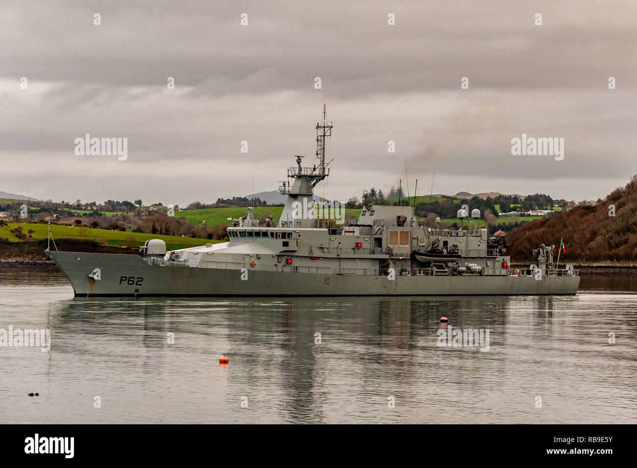 Bantry, West Cork, Ireland. 8th Jan, 2019. On the 40th Anniversary of the Whiddy Island disaster, in which the French oil tanker Betelgeuse exploded killing 50, a huge crowd attended the formalities in Abbey Graveyard, Bantry. Irish Naval Patrol Vessel LÉ James Joyce lies in Bantry Bay as a tribute to the dead.  Credit: AG News/Alamy Live News. Stock Photo