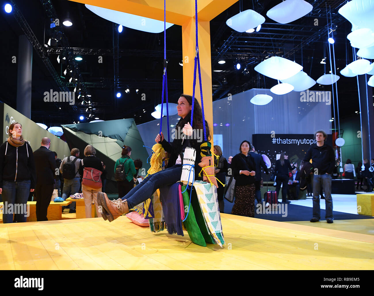 Frankfurt, Germany. 8th Jan, 2019. A visitor is seen on a swing made with colorful textiles during Heimtextil in Frankfurt, Germany, on Jan. 8, 2019. The World's largest international trade fair for home and contract textiles, namely Heimtextil, kicked off Tuesday in Frankfurt. Credit: Lu Yang/Xinhua/Alamy Live News Stock Photo