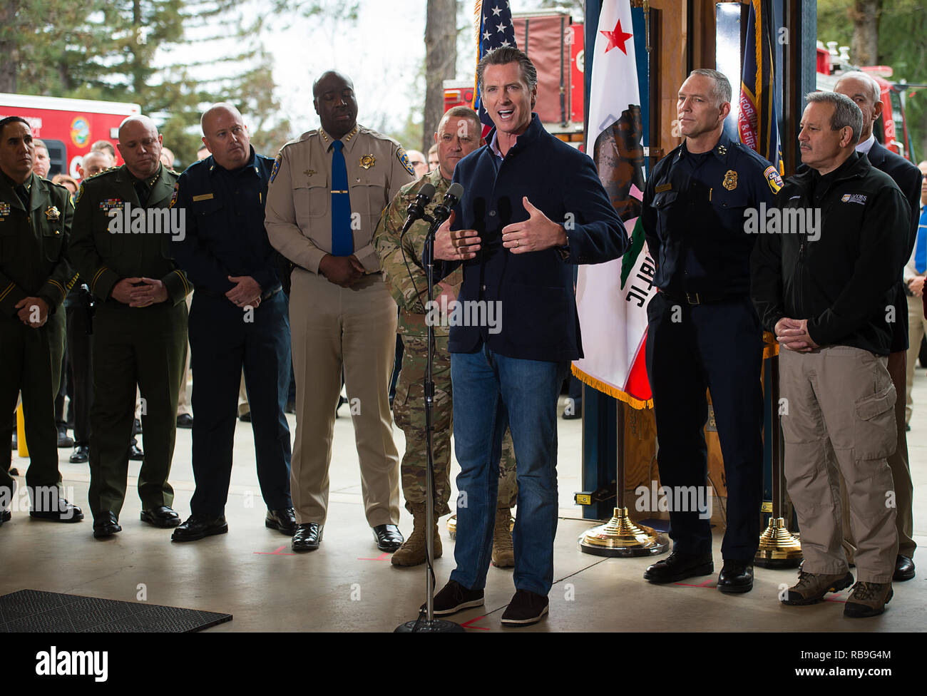 Colfax, CA, USA. 8th Jan, 2019. CHP Commissioner Warren Stanley, General David Baldwin, CalFire Chief Thom Porter and OES Director Mark Ghilarducci listen to Governor Gavin Newsom announce ''new executive actions'' regarding response to wildfires at the Colfax Cal Fire Station on Tuesday, January 8, 2019 in Colfax. Credit: Paul Kitagaki Jr./ZUMA Wire/Alamy Live News Stock Photo