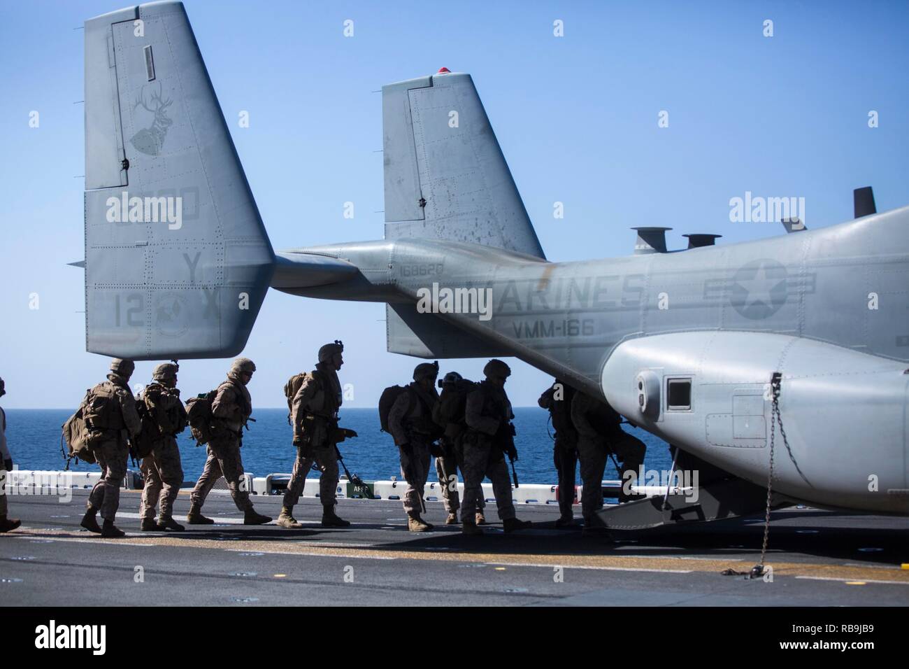 ARABIAN SEA – U.S. Marines with Lima Company, Battalion Landing Team 3/1, 13th Marine Expeditionary Unit (MEU), enter an MV-22B Osprey for a sparrow hawk training exercise aboard the Wasp-class amphibious assault ship USS Essex (LHD 2), Jan. 6, 2019. The Essex is the flagship for the Essex Amphibious Ready Group and, with the embarked 13th MEU, is deployed to the U.S. 5th Fleet area of operations in support of naval operations to ensure maritime stability in the Central Region, connecting the Mediterranean and the Pacific through the western Indian Ocean and three strategic choke points. (U.S. Stock Photo