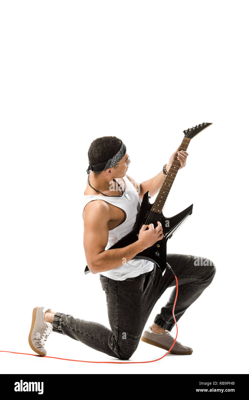 Mixed Rocker Guys young mixed race rocker playing on electric guitar isolated on white ...