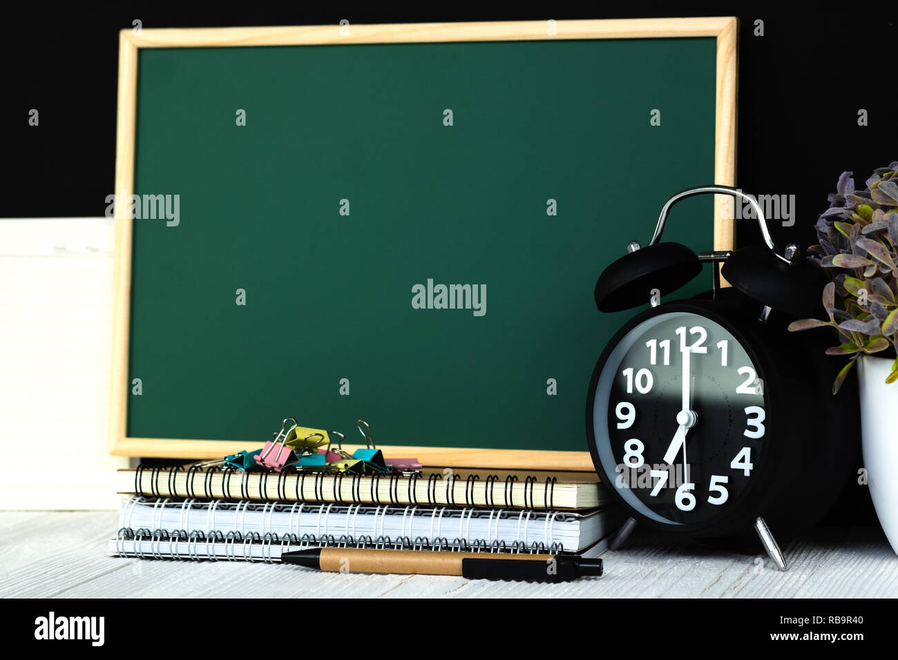 Back to school and education concept idea, green chalkboard with pile ...