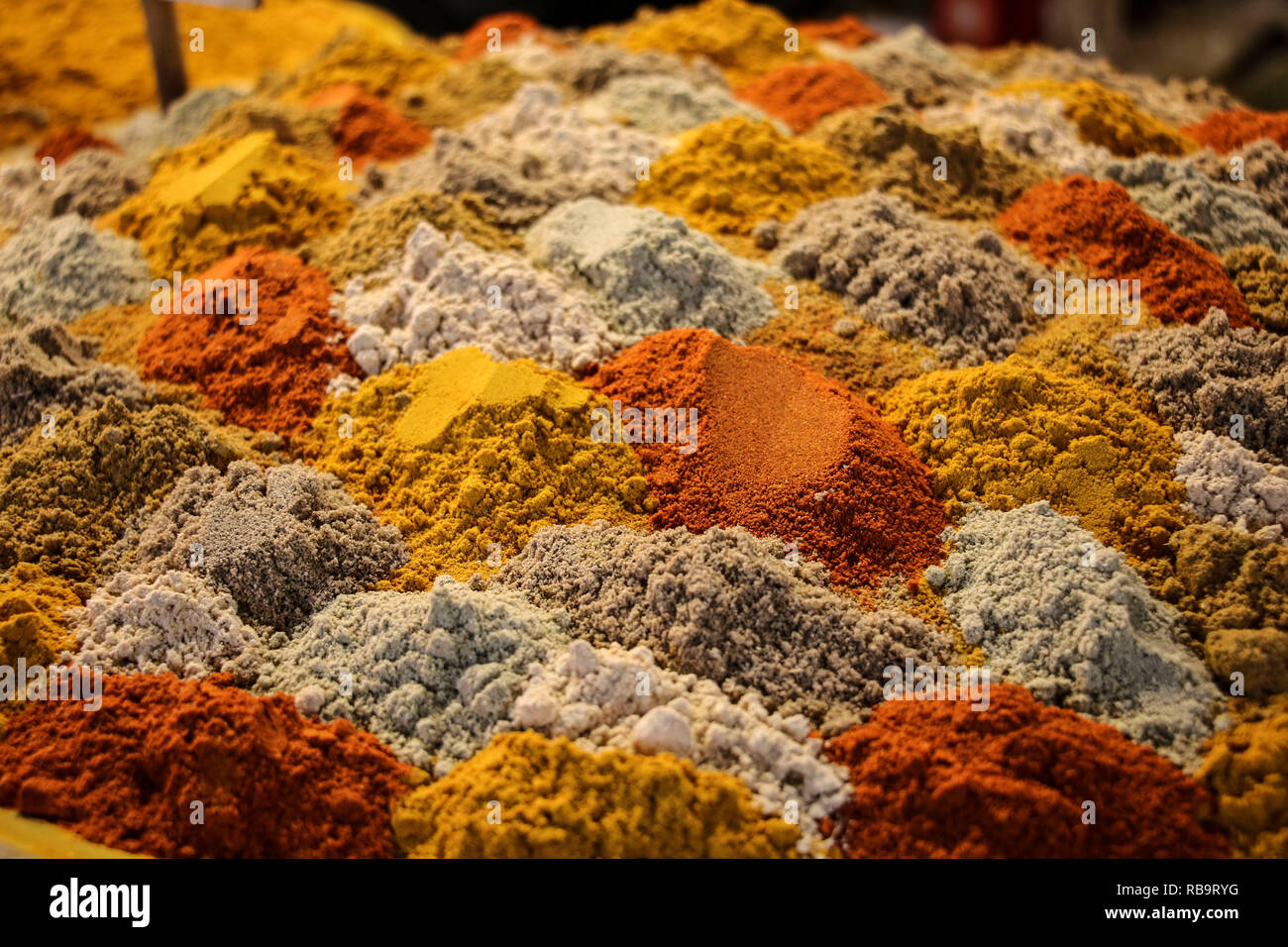 Piles of colourful mixed spices presented in layers at the bazaar of Isfahan, Iran. Stock Photo