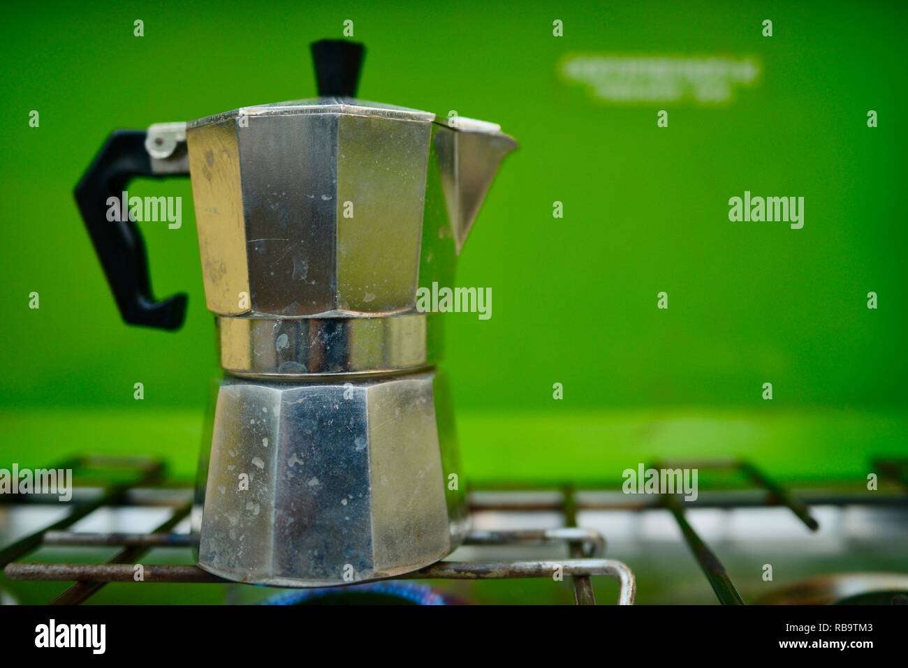 A Stovetop Espresso Maker on and old style camping gas stove, Smalleys