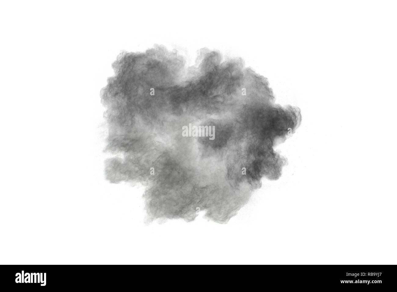 Black powder explosion against white background. Black dust particles splashing. Stock Photo