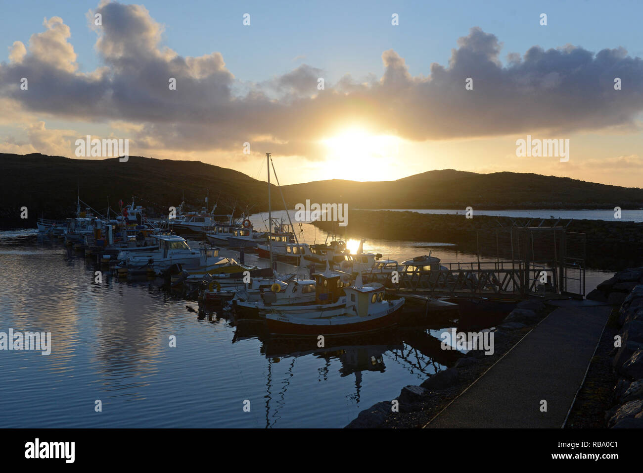Hamnavoe boat harbour marina on a sunny morning on the island of Burra in the Shetland Islands
