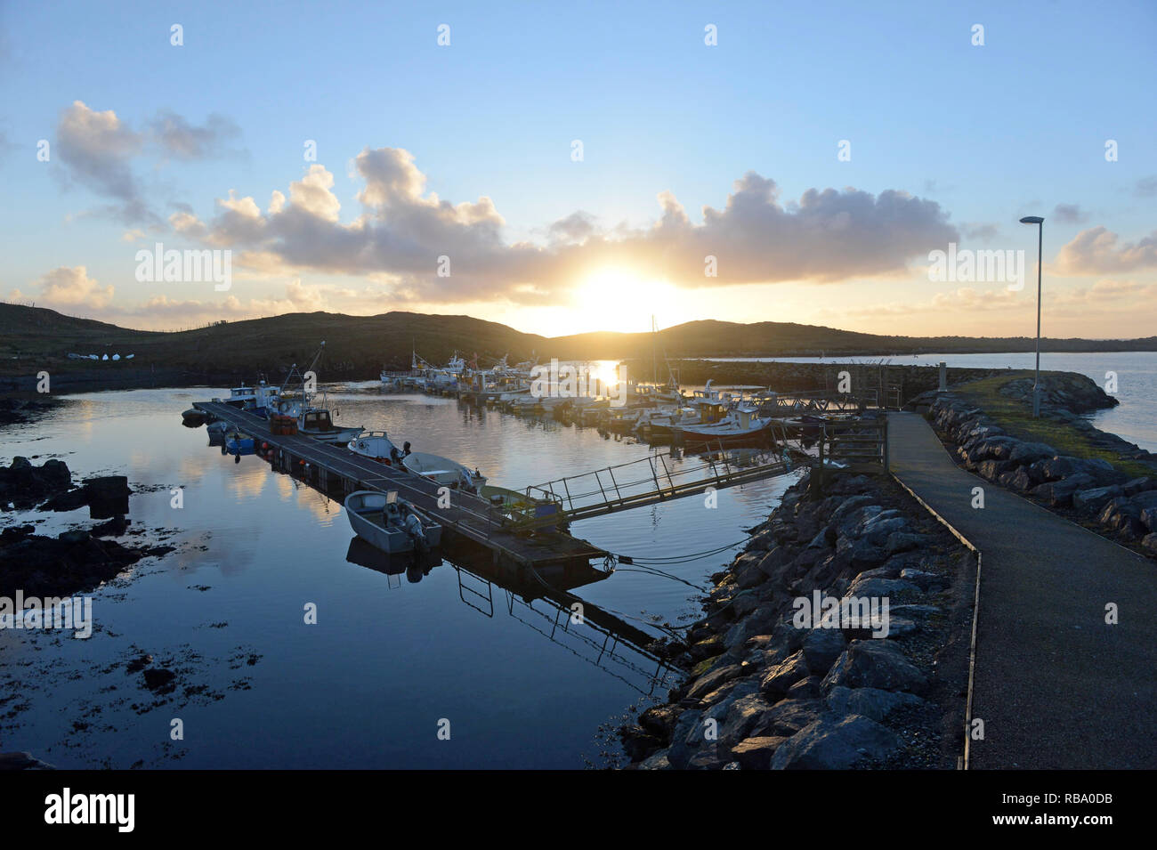 Hamnavoe boat harbour marina on a sunny morning on the island of Burra in the Shetland Islands