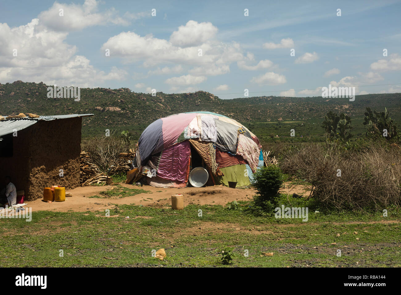 Harar / Ethiopia - May 2017: Somali Huts constructed with branches and plastic wraps, not far outside the city of Harar. Stock Photo