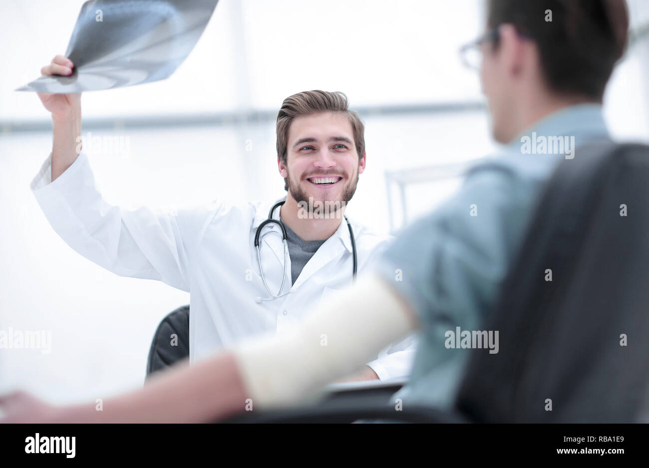 orthopedist examining a radiograph of a patient Stock Photo