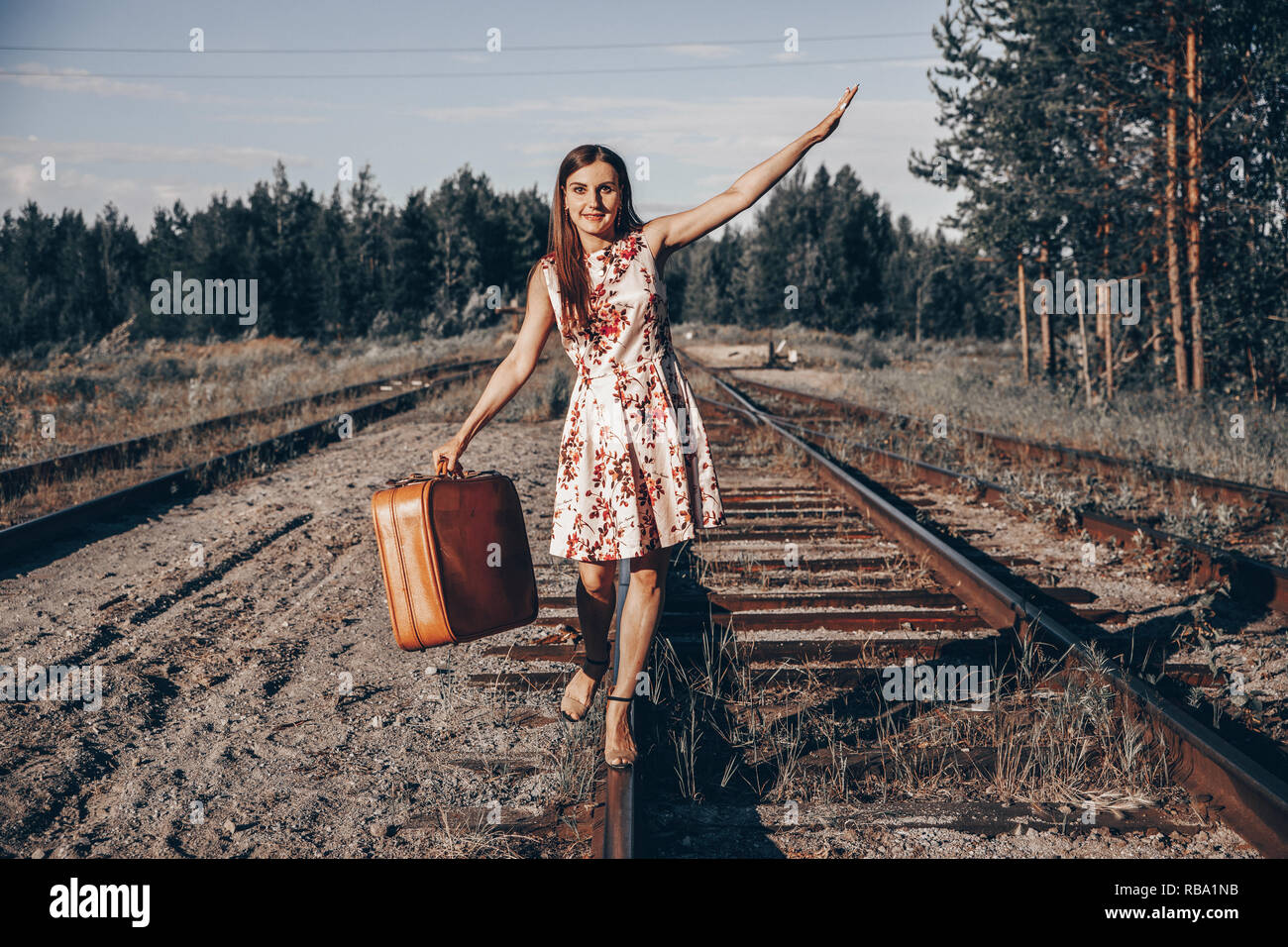 Girl Standing On Railroad Track High Resolution Stock Photography and