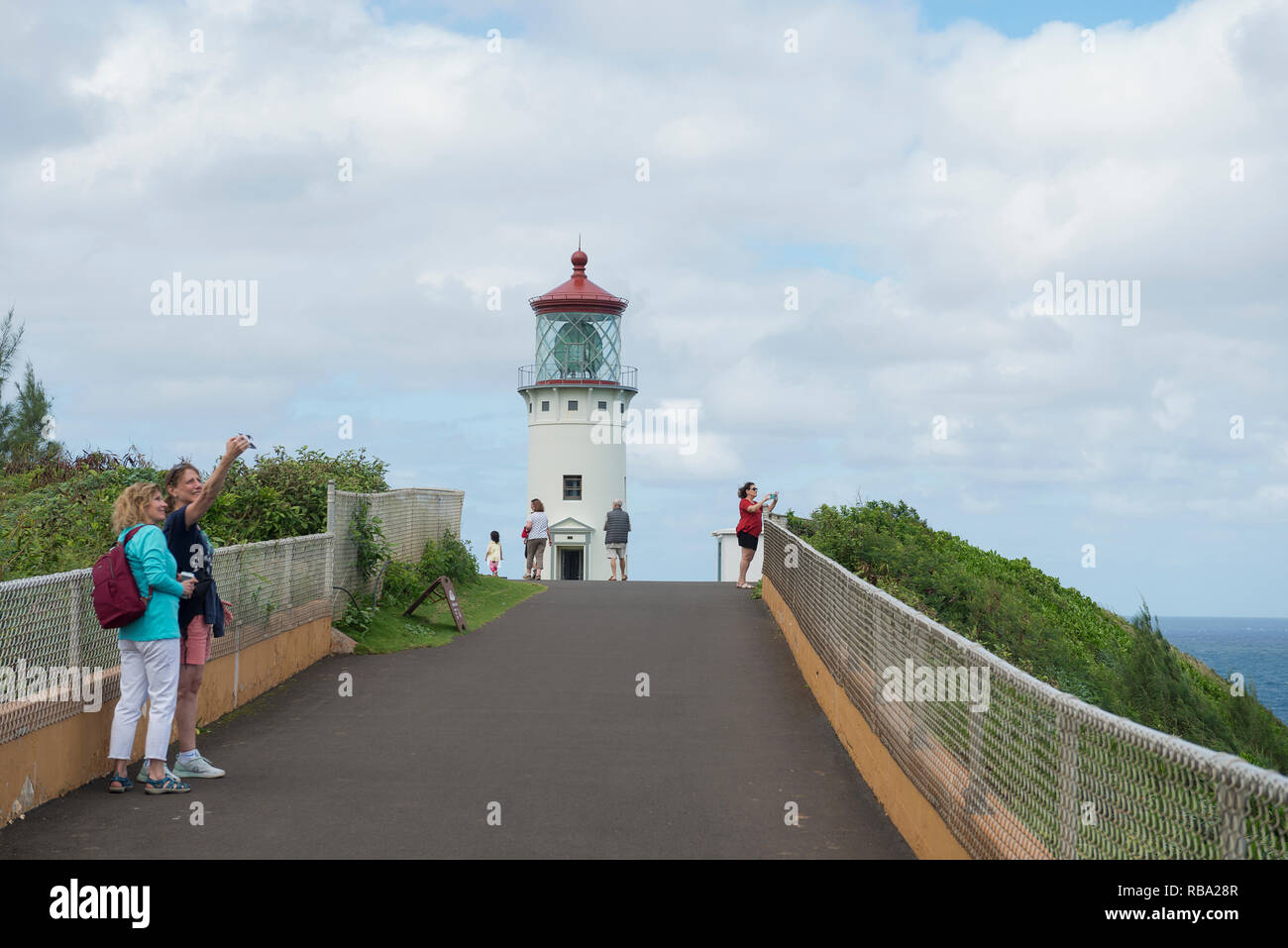 Tourists at Kilauea Lighthouse in Kauai, Hawaii, just outside of Princeville. Stock Photo