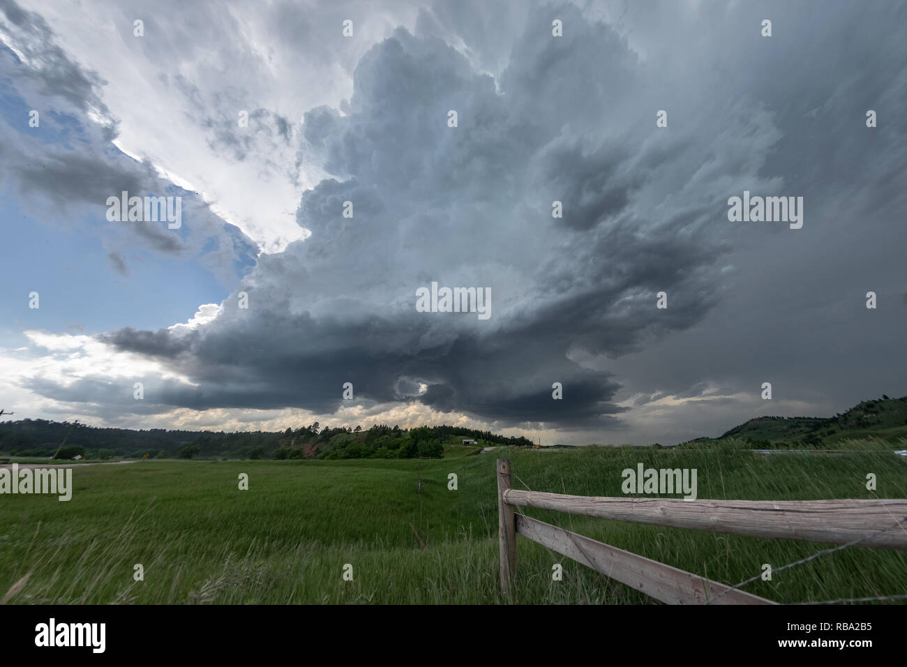 Dramatic rotating wall clouds of a supercell thunderstorm over the ...