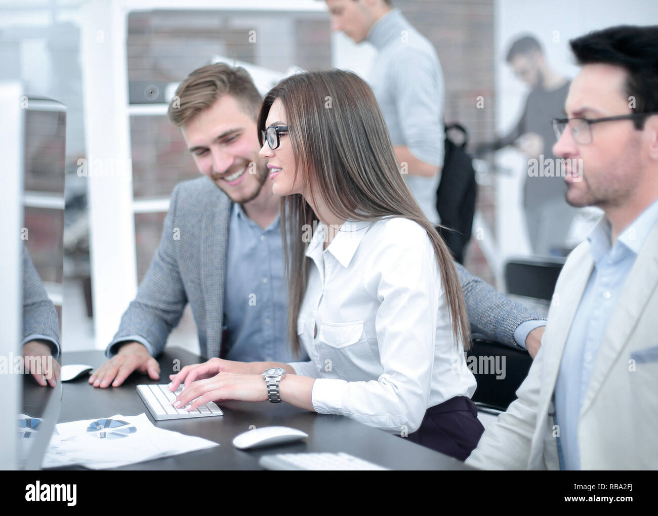 group of business people sitting at the office table Stock Photo - Alamy