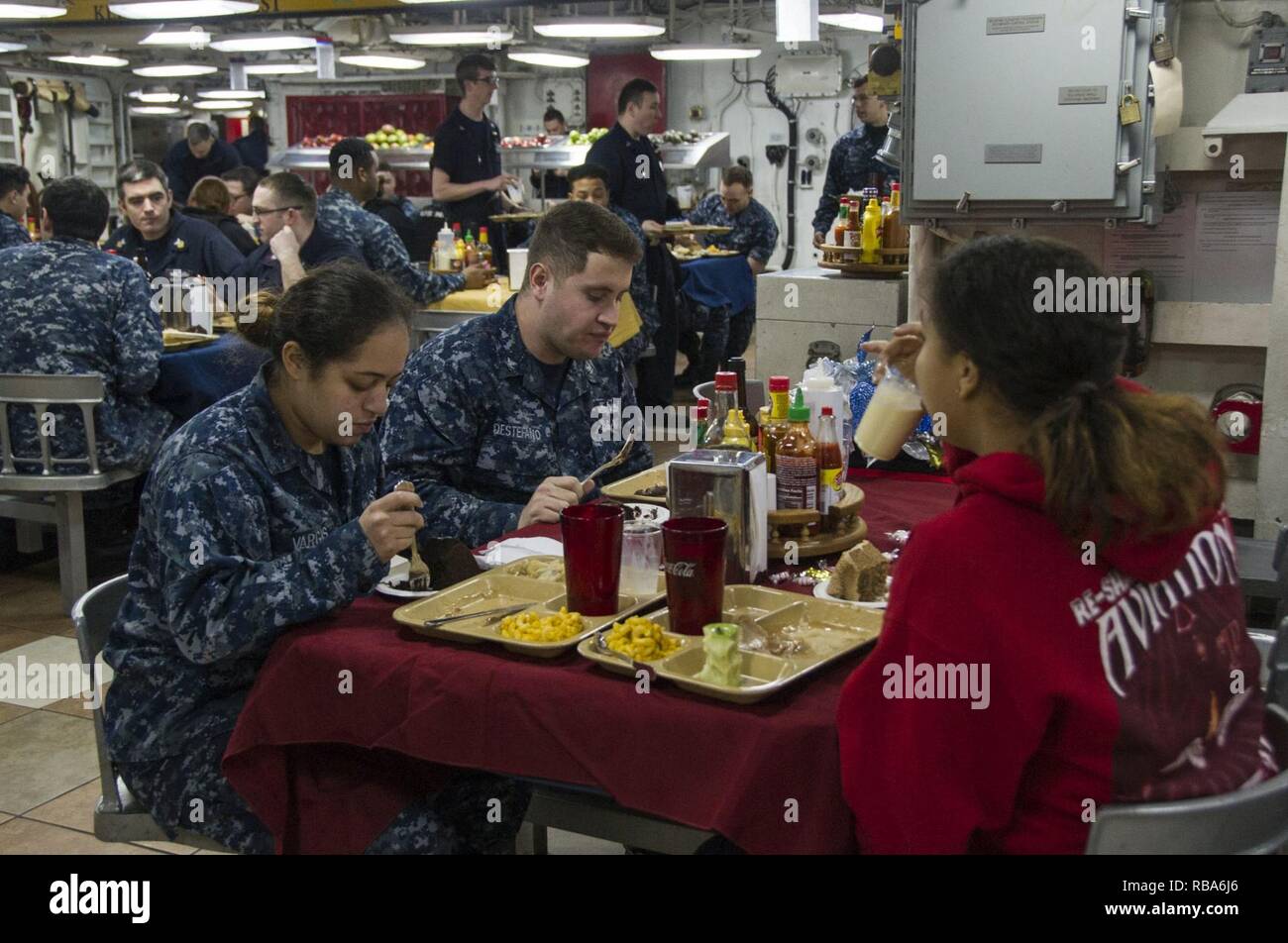 NORFOLK (Dec. 25, 2016) Sailors eat Christmas dinner aboard the aircraft carrier USS