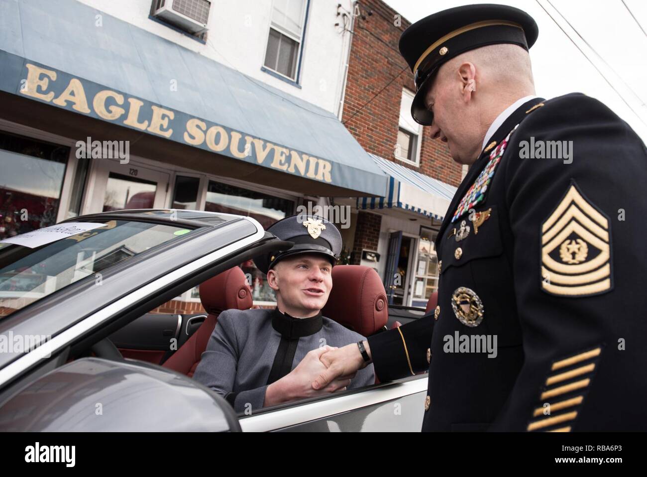 U.S. Army Command Sgt. Maj. John W. Troxell, Senior Enlisted Advisor to the  Chairman of the Joint Chiefs of Staff, greets West Point Cadet Michael  Singer, his driver for the parade, before