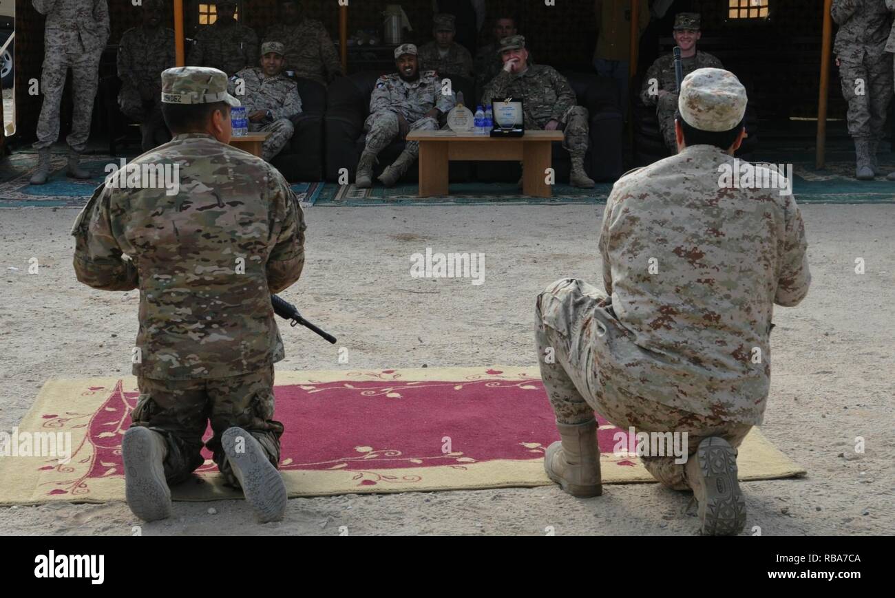 Maj. Gen. Blake Ortner, commander of the 29th Infantry Division, watches with Col. Col. Jabar Al-boti of the Kuwaiti Air Defense Force as their soldiers compete to assemble an M-16 rifle during Patriot Day at the Kuwaiti Air Defense Force Headquarters December 28, 2016. The friendly competition between the Kuwaitis and the 69th Air Defense Artillery Brigade included events such as setting up an MIM-104 Patriot weapons system, a soccer game, and tug-of-war. ( Stock Photo