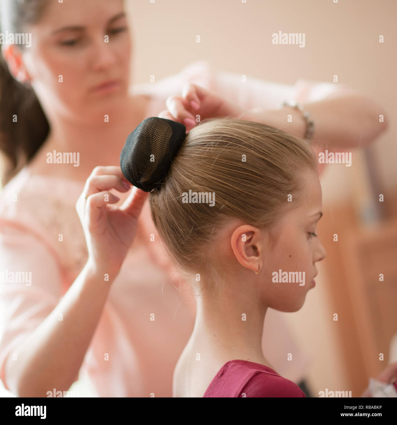 Caring Young Caucasian Mother Woman Fixing Her Little Beautiful
