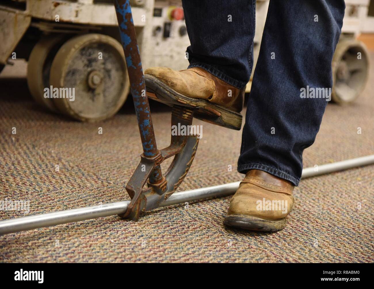 Shawn Ahern, DNP Inc. electrician, bends a piece of conduit at the