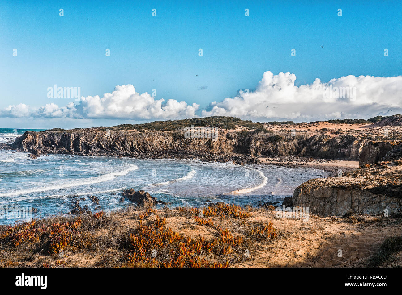 ocean algarve portugal beach sand water green blue sky waves drone