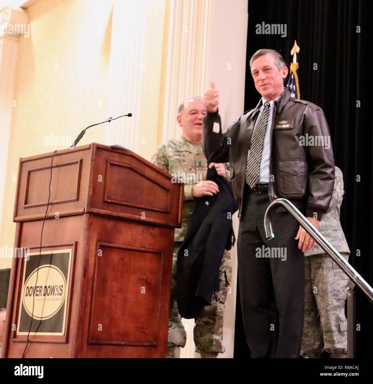 Governor Elect John Carney receives a leather flight jacket, welcoming