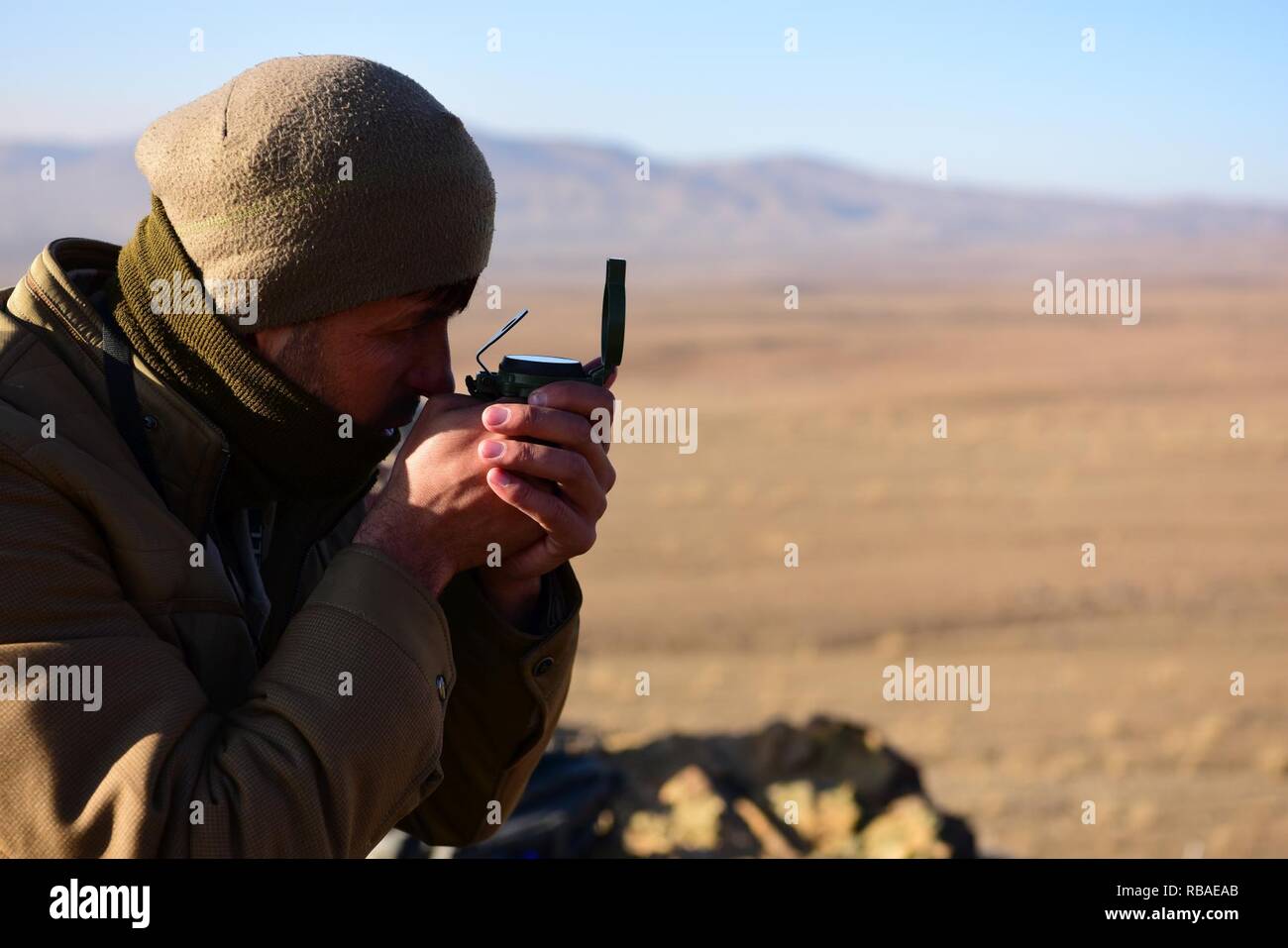 An Afghan Air Force Tactical Air Coordinator student uses a compass ...