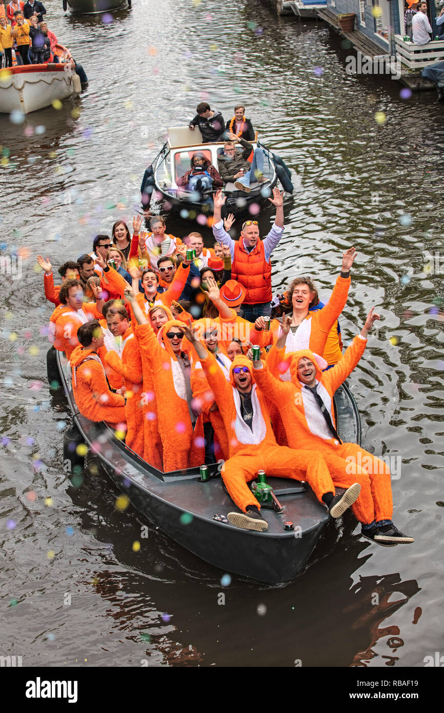 The Netherlands, Amsterdam, Yearly festival to celebrate the birthday of  king Willem-Alexander. Kingsday, 27 April. People mainly dressed in orange.  C Stock Photo - Alamy