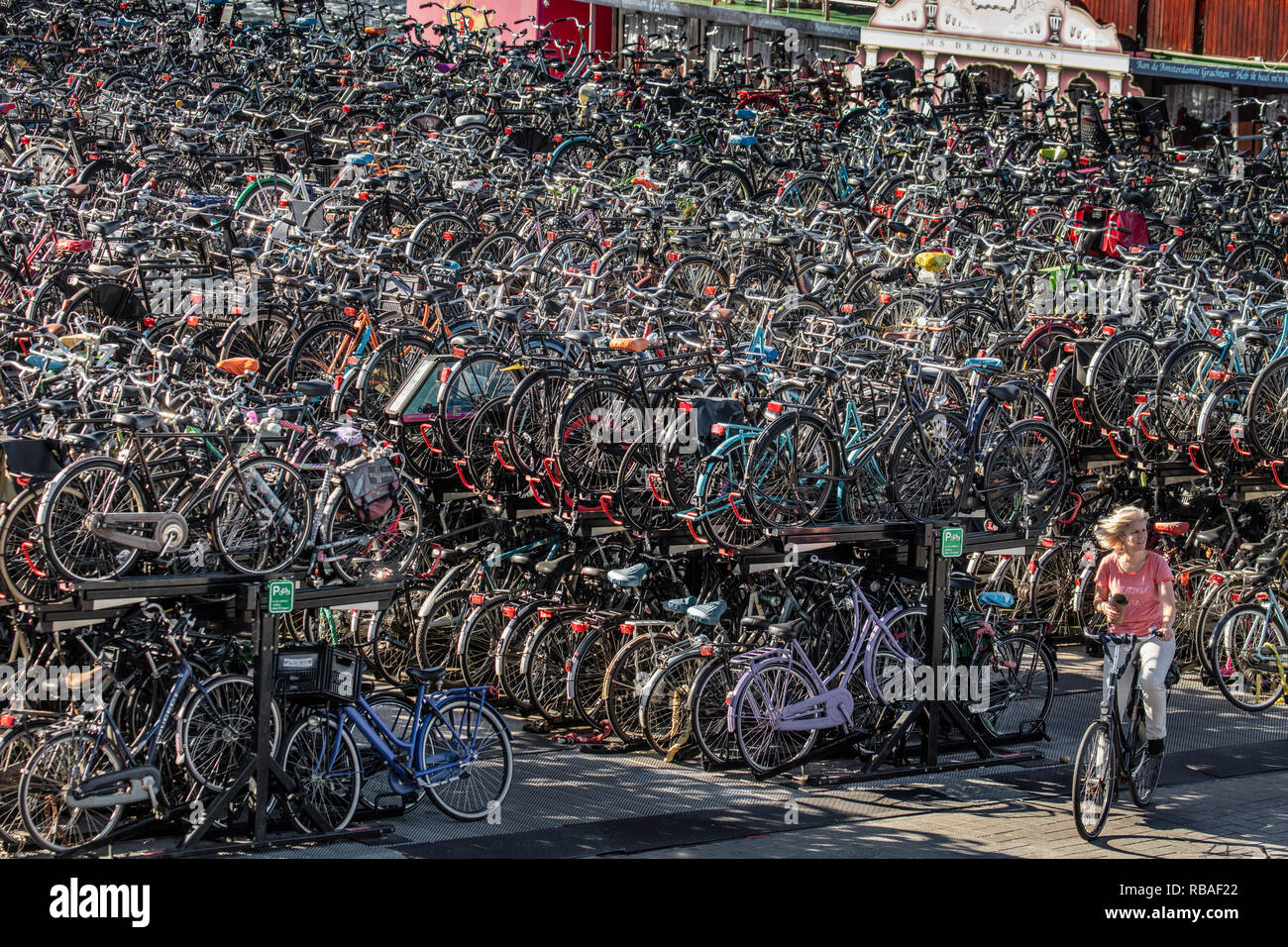 The Netherlands, Amsterdam, Central station, bicycle storage or parking. Stock Photo