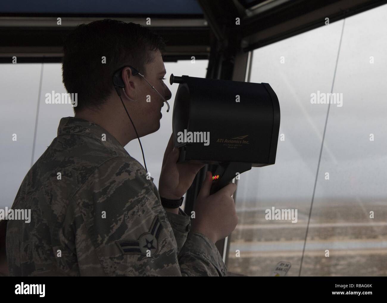 Airman 1st Class Joseph Pennetti, 54th Operations Support Squadron air traffic control trainee, tests a light gun Dec. 18, 2018, in the air traffic control tower on Holloman Air Force Base, N.M. Air traffic control Airmen test the light gun daily and use it to communicate with aircraft and vehicles when the radios fail. Stock Photo