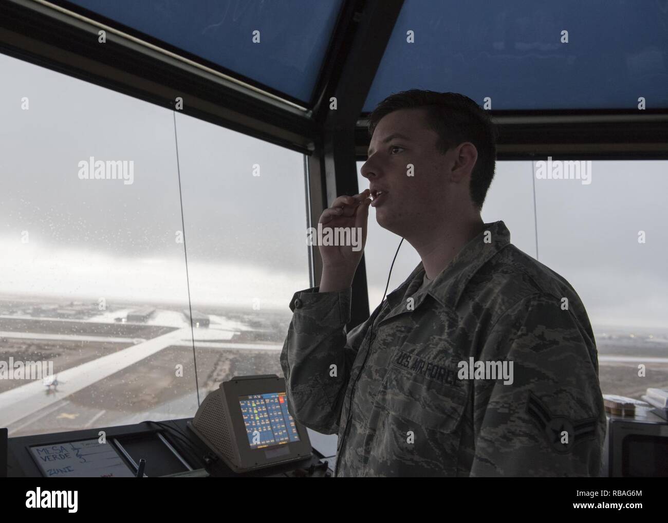 Airman 1st Class Joseph Pennetti, 54th Operations Support Squadron air  traffic control trainee, directs a pilot to exit the runway on Dec. 18,  2018, in the air traffic control tower on Holloman