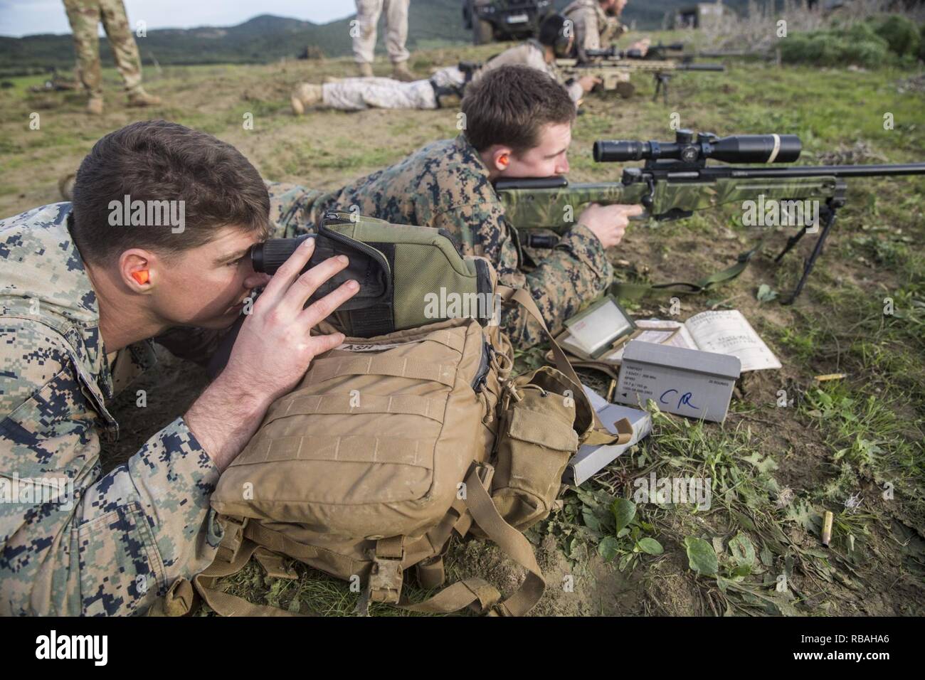 U.S. Marines with Special Purpose Marine Air-Ground Task Force-Crisis Response-Africa and Spanish reconnaissance soldiers fire M40 A6 and SAS M110 sniper rifles during a training event in Sierra De Retin, Spain, Dec. 19, 2018. SPMAGTF-CR-AF is a rotational force deployed to conduct crisis-response and theater-security operations in Europe and Africa. Stock Photo