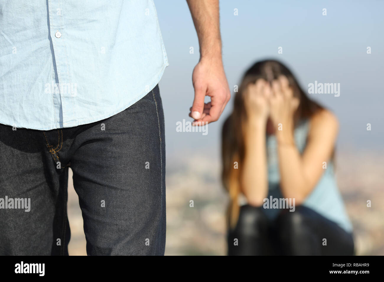 Sad woman complaining outdoors after break up. Boyfriend leaving her Stock Photo