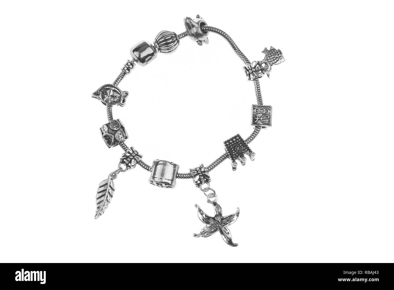 Small silver charm bracelet with many charms isolated on white background  Stock Photo - Alamy