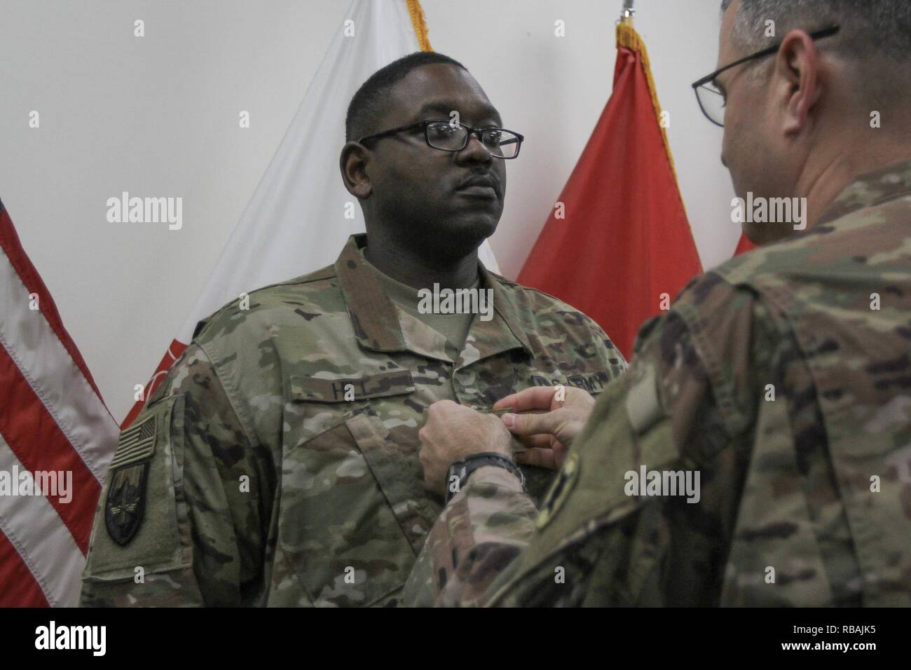 Jesse Hill is promoted to the rank of major at Camp Arifjan, Kuwait, by Brig. Gen. Clint E. Walker, 184th Sustainment Command. Stock Photo
