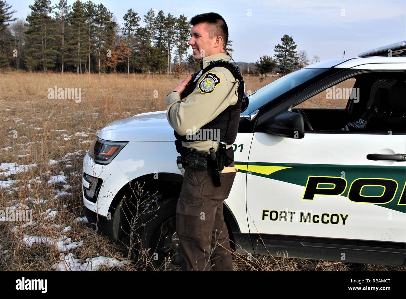 Game Warden Jesse Haney with the Directorate of Emergency Services Police  Department works in the field Dec. 26, 2018, at Fort McCoy, Wis. Haney,  along with Game Warden Art Casserberg, support Fort