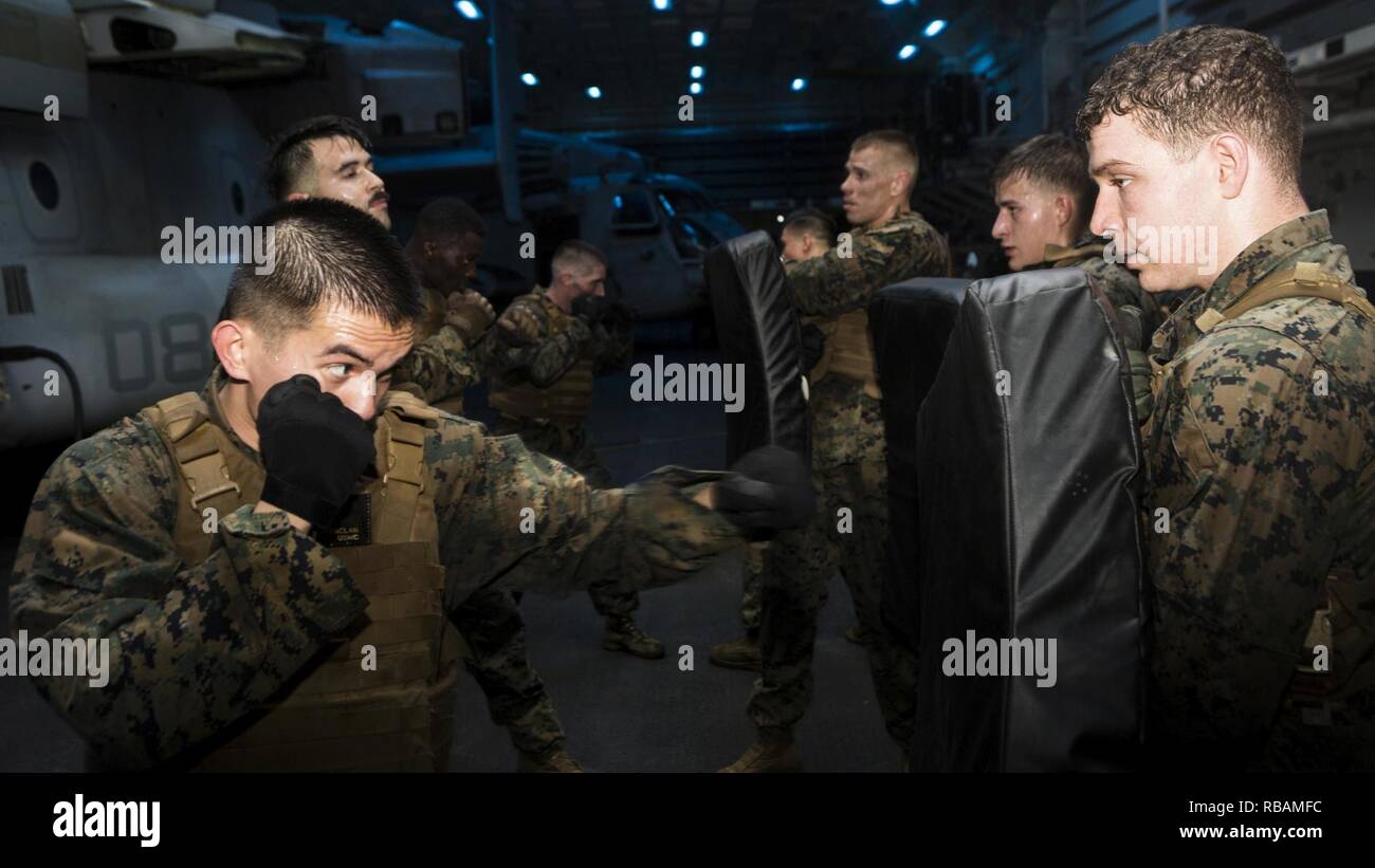 ARABIAN GULF U.S. Marine Cpl. Malone Daklan, left, a tool room clerk