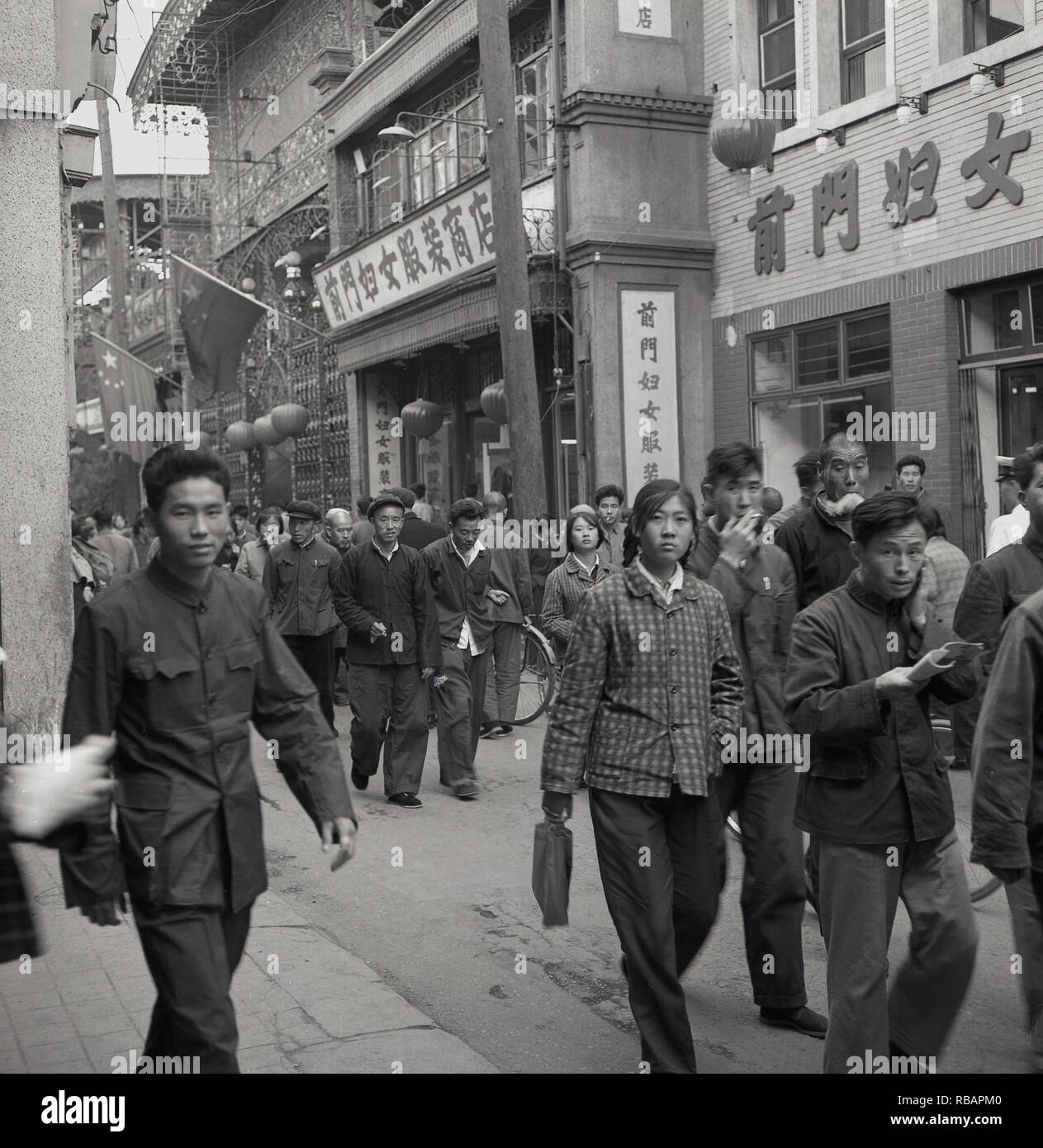 1950s, historical, Beijing, China, young chinese people, workers and/or students, walking through a city street. Stock Photo