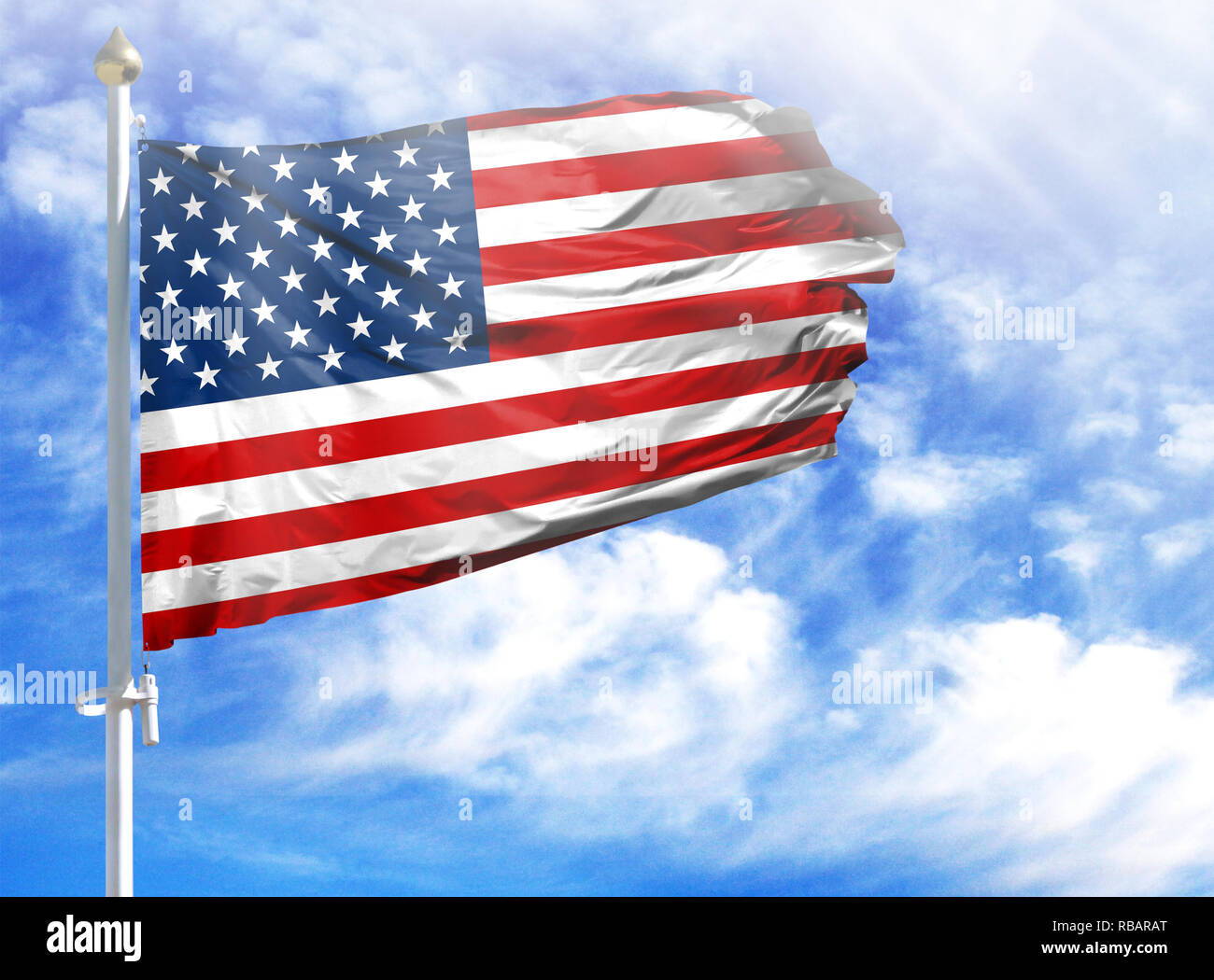 National flag of USA on a flagpole in front of blue sky Stock Photo - Alamy