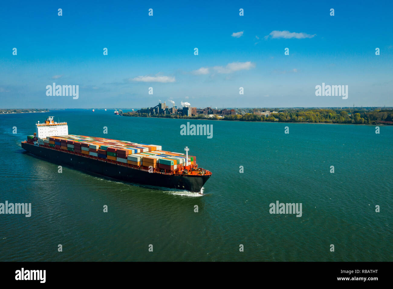 Aerial view of a container ship going upstream in the St. Lawrence River near the port of Montreal in Canada Stock Photo